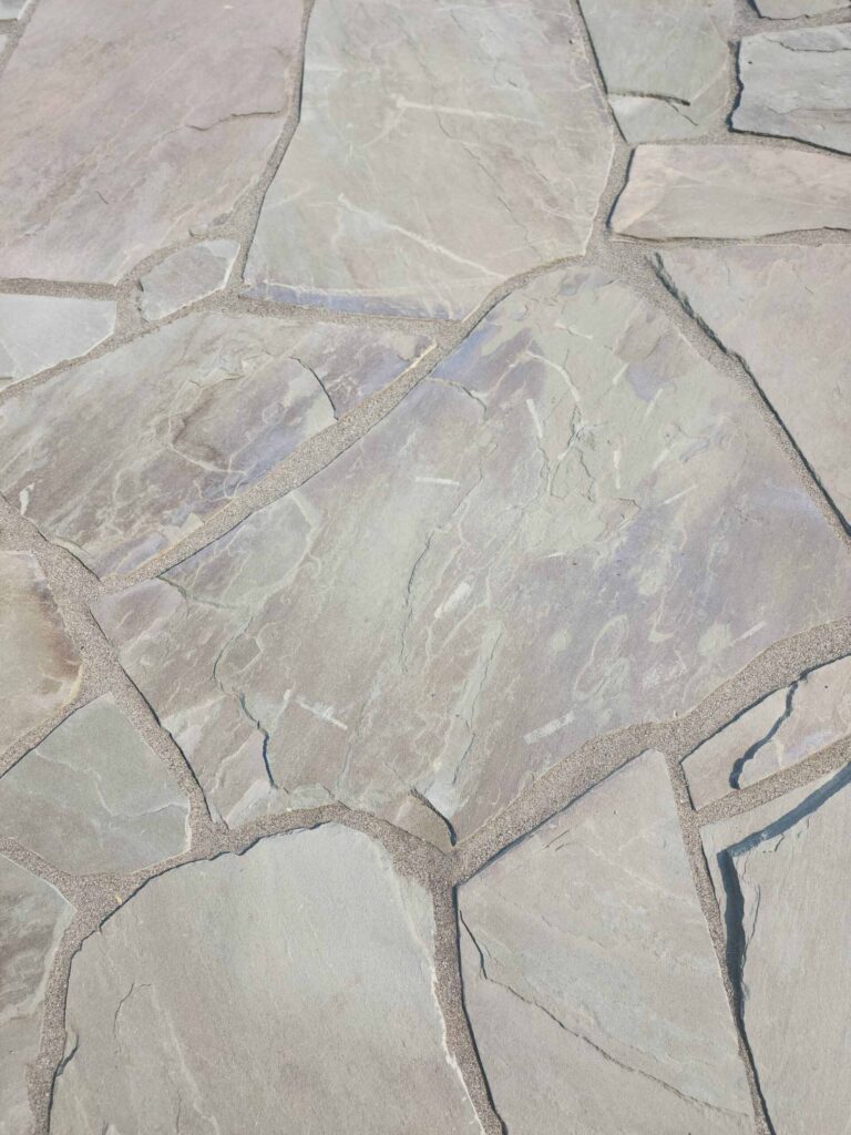 20230825_115921-scaled Landscaping example: Close up of a few stone tiles, showing the layers of natural coloring