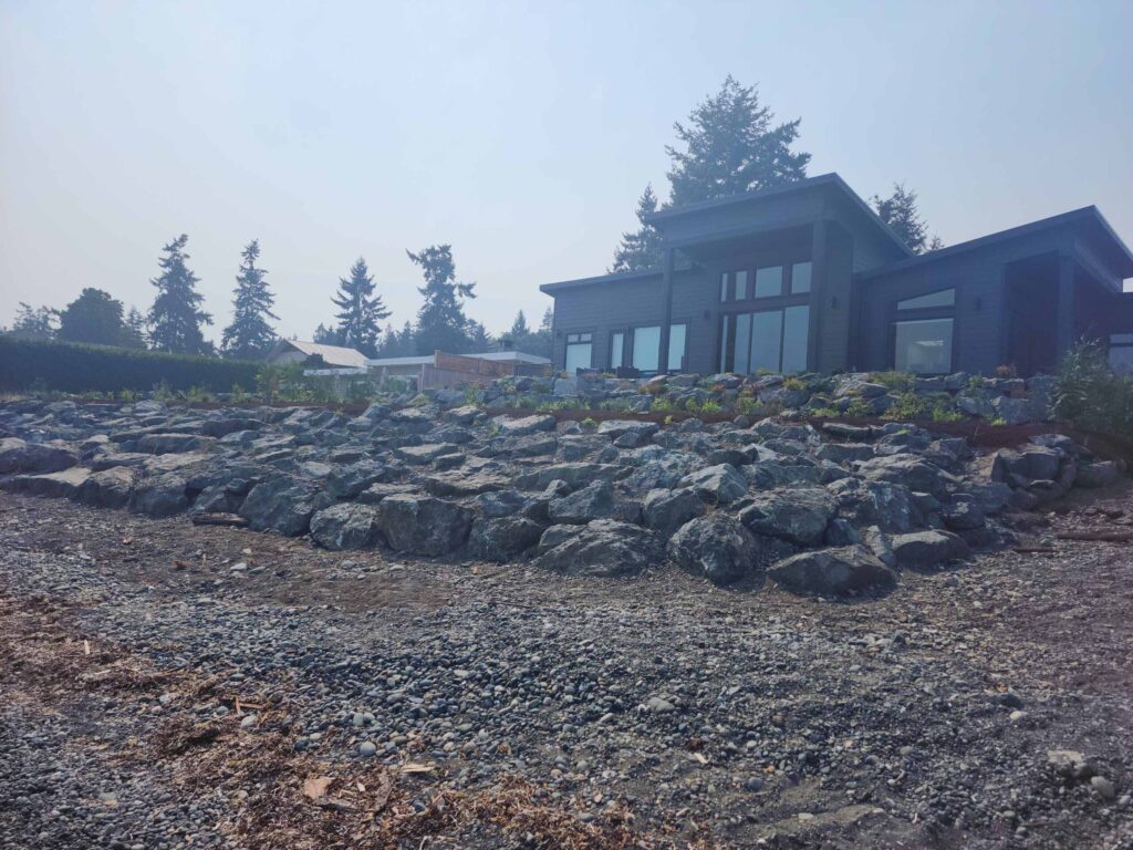 20230825_120236-scaled Landscaping example: view of ocean revetment with home in the background