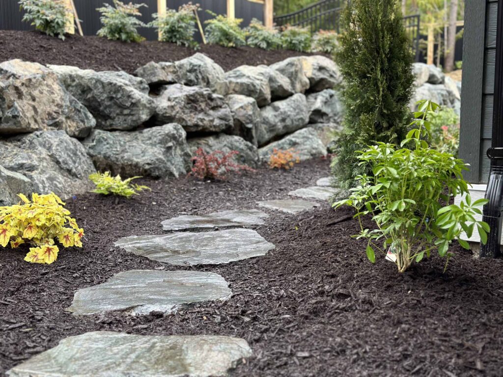 IMG_0431-scaled Landscaping example: A stone retaining wall next to a irregular stone pathway (adds a natural look)
