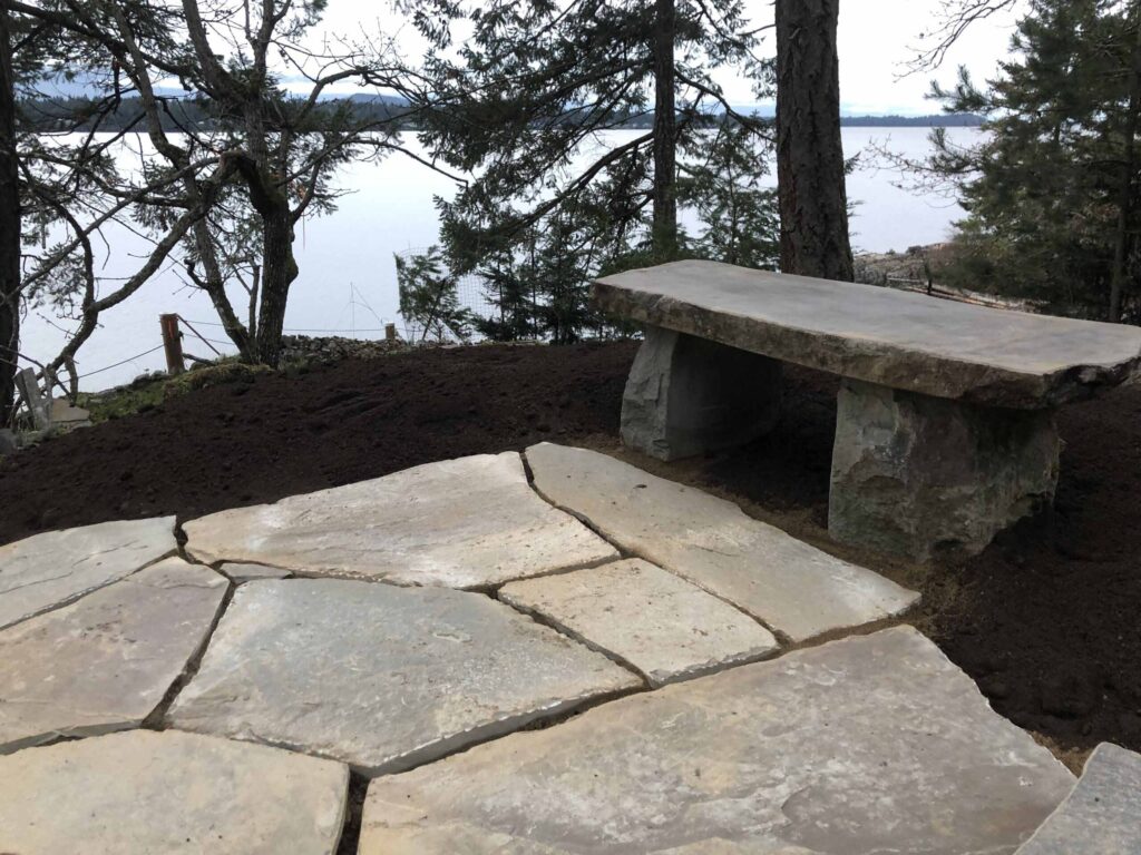 IMG_0557(1)-scaled Landscaping example: A rustic stone bench.