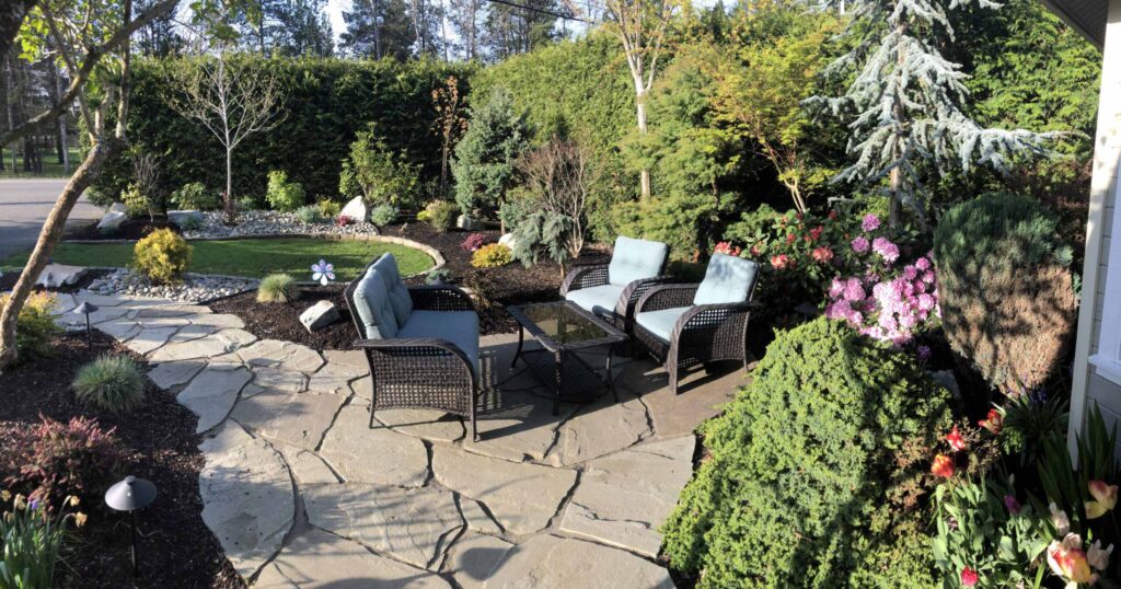 IMG_0754-scaled Landscaping example: alternative view of seating area with additional pebbles and curved landscaped bed.