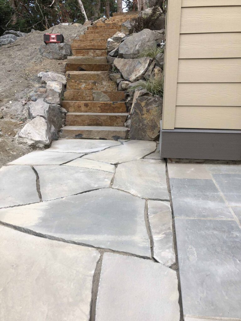 IMG_1266-scaled Landscaping example: At the base of a stone staircase are tiles with a different look and feel.