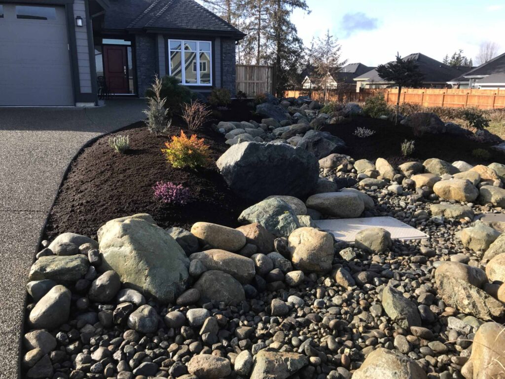 IMG_1466-scaled Landscaping example: Rock and stone features in this landscaping project look great even when the sun is setting.
