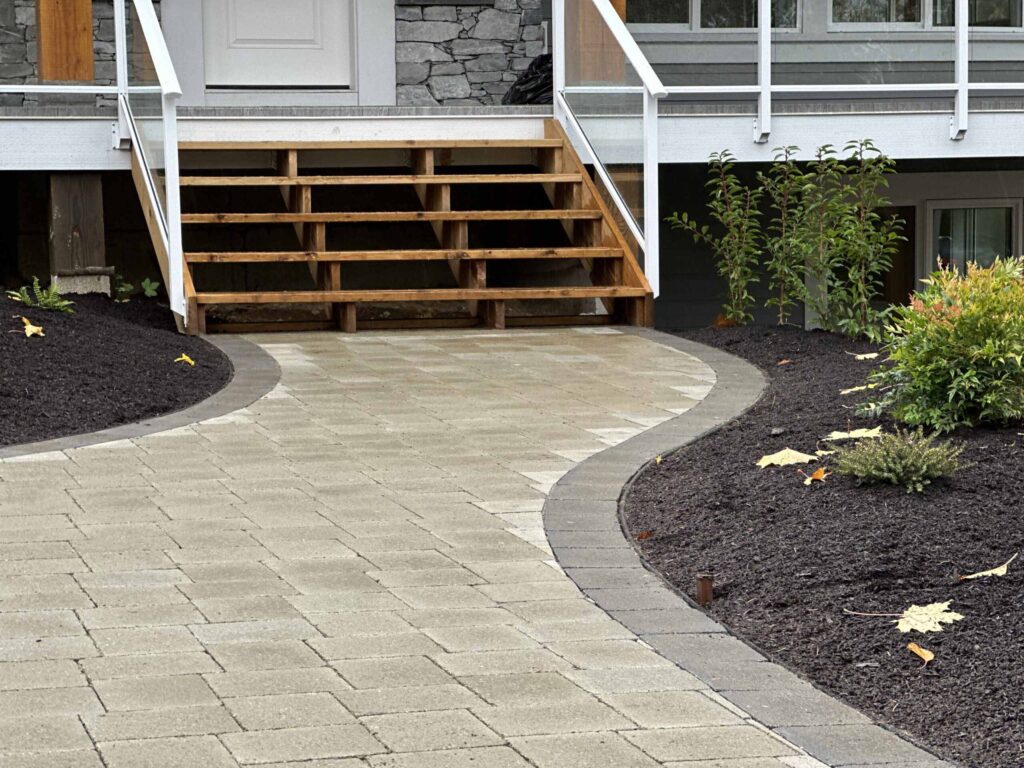 IMG_1572-scaled Landscaping example: Close up of a newly landscaped garden bed next to curved pathway.