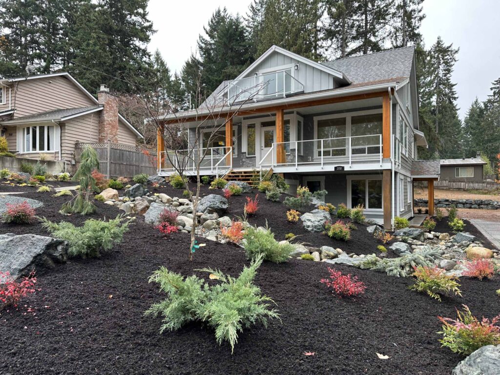 IMG_1612-scaled Landscaping example: View of front yard, landscaped with low maintenance shrubs, trees, and other foliage