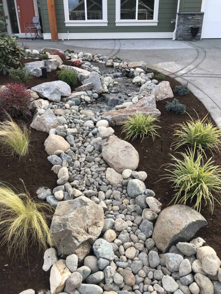IMG_2202-scaled Close up of a stone path with water feature.